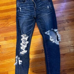 Size 10 American eagle dark blue ripped jeans.